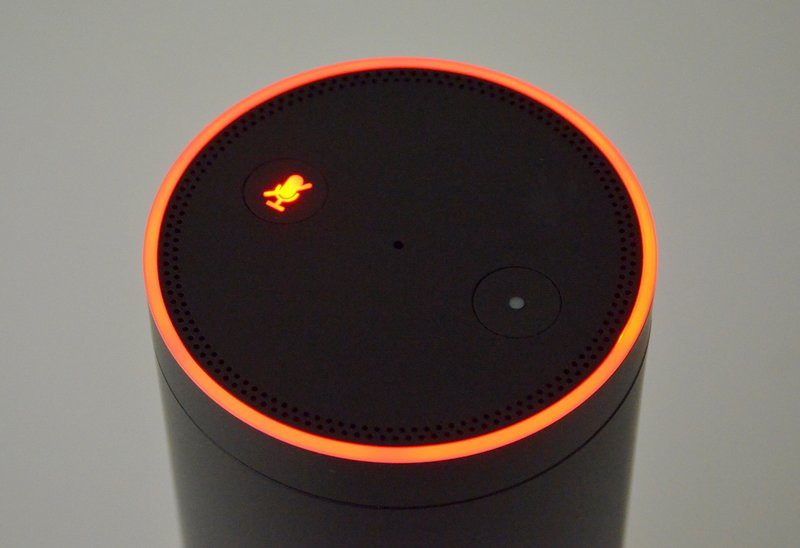 Amazon Echo glowing in orange colour