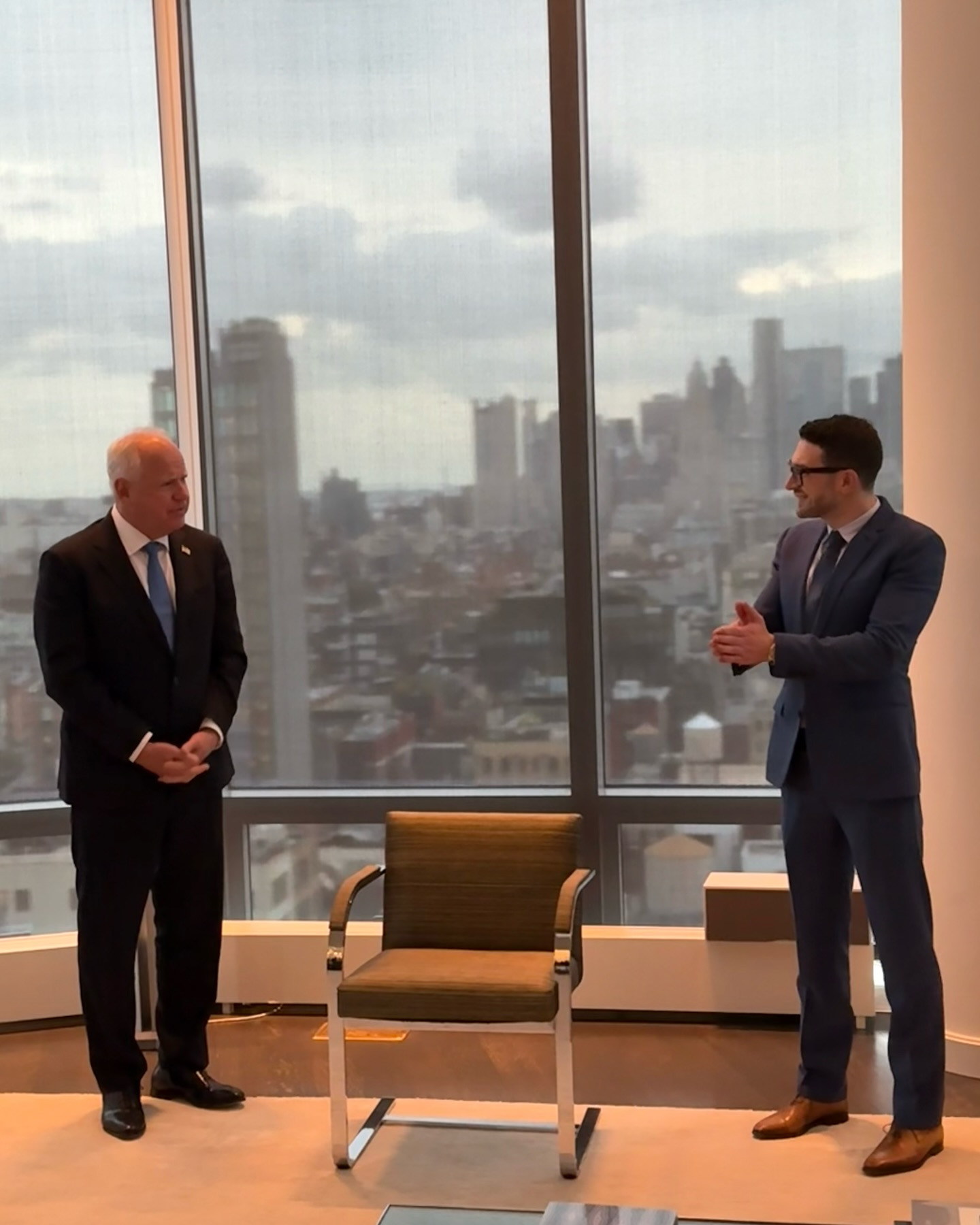 Alex Soros hosts Tim Walz at his New York City home, showcasing the Manhattan skyline.