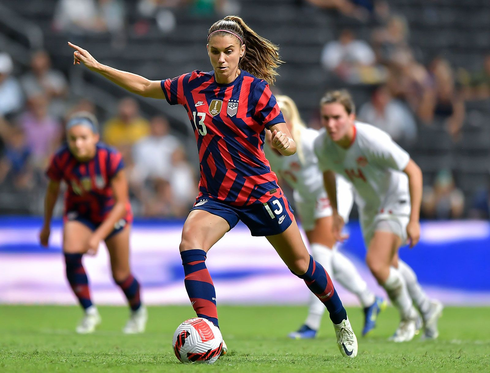 Alex Morgan celebrating a goal