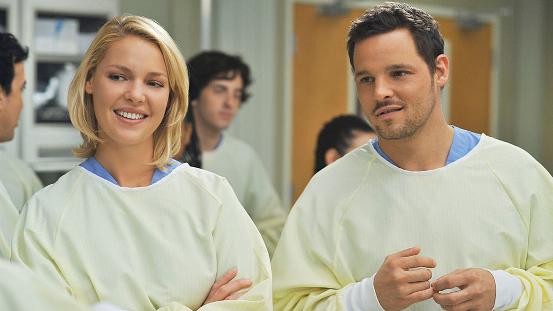 Alex and Izzie laughing together in Grey